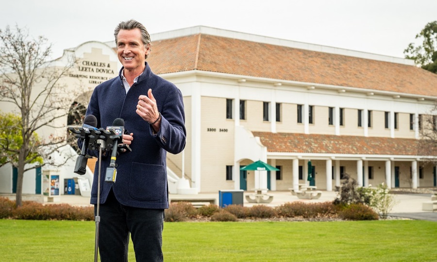 Gov. Gavin Newsom, speaking into a microphone during visiting Cuesta College in March 2021, released his proposed budget for the 2023-24 fiscal year this week.