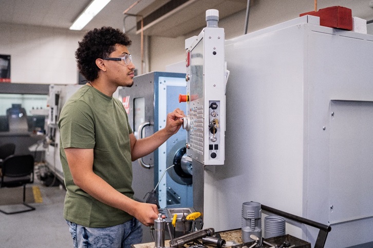 Male student working on technical equipment